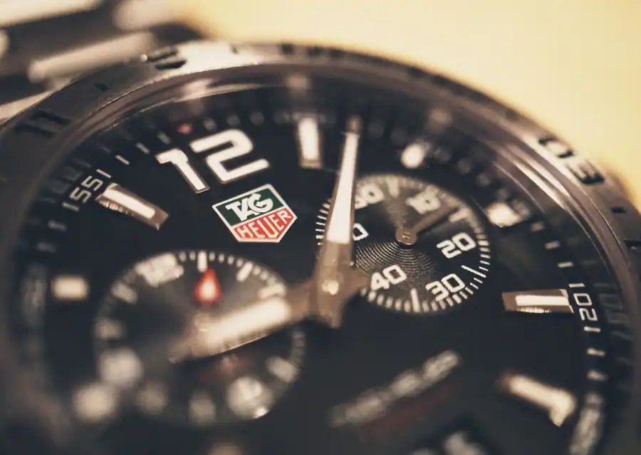 Detailed macro shot of a luxury analog wristwatch showcasing the intricate design and craftsmanship.